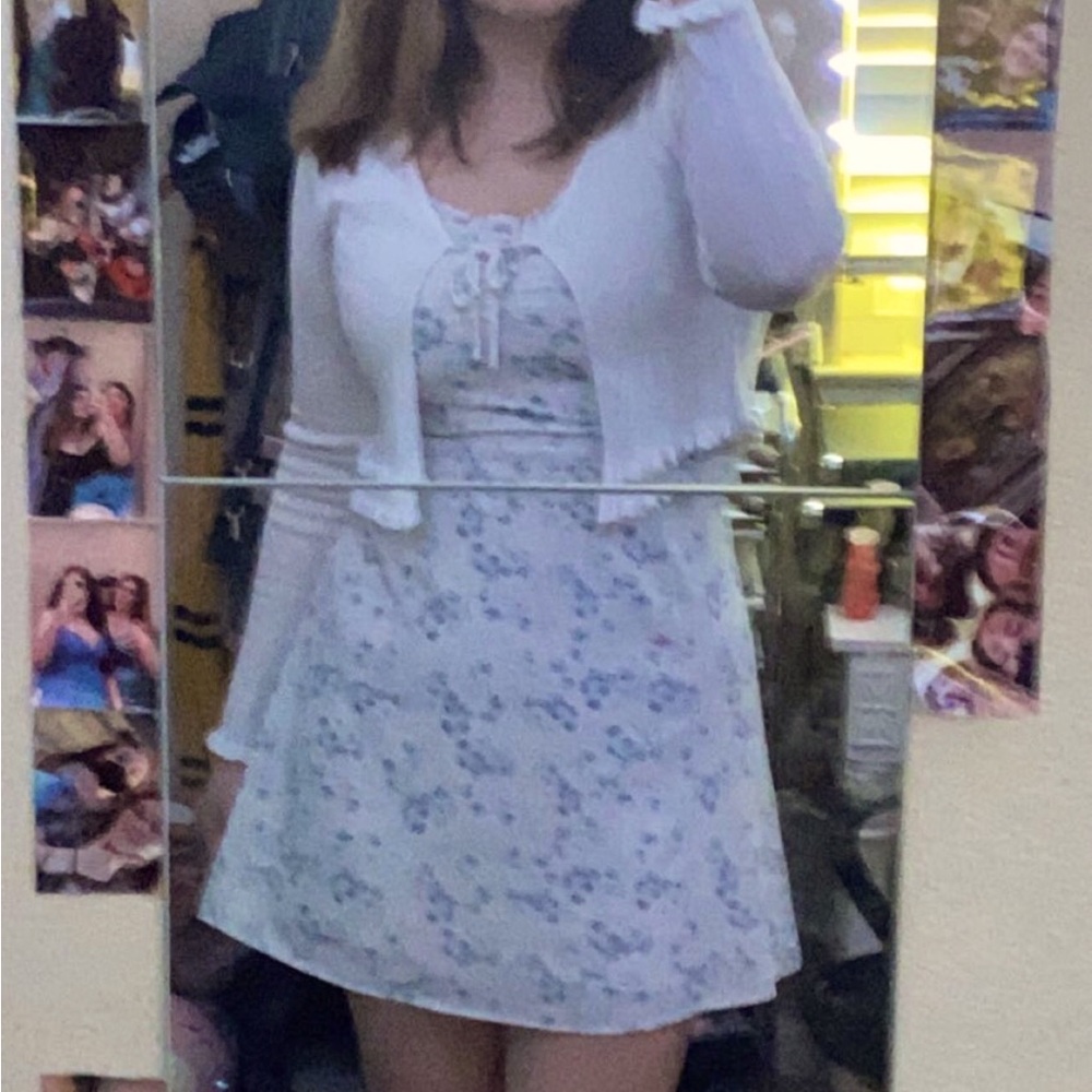 White dress with blue flowers. Zip up in the back. Size Large